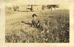 Male Lying in Grass, Leather Photographs Album of State Normal School Student Albie Gunnells Knight by unknown