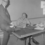 Colonel George Haskins and Student, 1967 Fall Class Registration in Leone Cole Auditorium 2 by Opal R. Lovett
