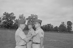 Colonel George D. Haskins pins Major William Willie Cline as Second Lieutenant Cleo Bynum Stands Waiting 4 by Opal R. Lovett