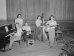 Members of Ted Kirby's Band Inside College Gymnasium 3 by unknown