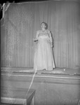 Female Sings on Stage by unknown