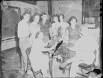Group Inside Classroom Gathered Around Film Projector 1 by Opal R. Lovett