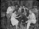 Group Inside Classroom Gathered Around Film Projector 2 by Opal R. Lovett