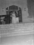 Bride and Groom on Bibb Graves Hall Porch by unknown