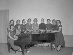 Student Club Surrounds Piano with Faculty Advisor Esther Baab by Opal R. Lovett