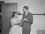 Adult Male and Female Student Hold Pamphlet Together by Opal R. Lovett