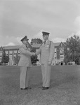 Lt. Col. John Brock Shakes Hands with First Lt. A.W. Bolt on Quad Behind Bibb Graves Hall by Opal R. Lovett