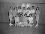 Physical Education Instructor Frances Hanson with Female Students Inside Gymnasium 2 by Opal R. Lovett