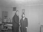 Basketball Coach Tom Roberson Shakes Hands with Manager Bobby Lucas by Opal R. Lovett