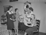 Employees Decorate for the Christmas Season 1 by Opal R. Lovett