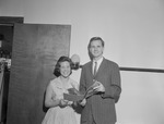 Adult Male and Female Student Hold Pamphlet Together 2 by Opal R. Lovett