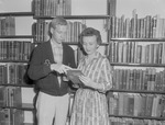 Jim Bennett Presents Book to Librarian Doris Bennett, 1959 National Library Week 1 by Opal R. Lovett