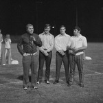 Coach Jim Fuller at Microphone during 1971 Football Pep Rally in Stadium by Opal R. Lovett