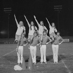 Cheerleaders Perform during 1971 Football Pep Rally in Stadium 2 by Opal R. Lovett
