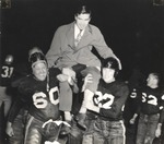 Football Players Carry Coach Don Salls After Paper Bowl Win by unknown