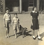 Three Training School Students Outside Kilby Hall with Dog by unknown
