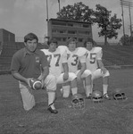 Circa 1975 Football Players with Coach Clarkie Mayfield 1 by Opal R. Lovett