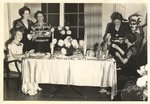 Women around Refreshment Table during Reception by unknown