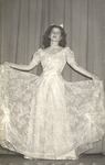 Unknown Female Wearing Dress Standing on Stage by unknown