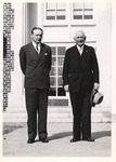 President Houston Cole and Male Individual outside Campus Building by unknown