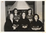 Five Female Choir Students holding Programs while Singing by unknown