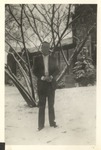 Unidentified Male Standing in the Snow Outside Bibb Graves Hall by unknown