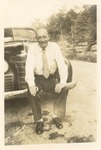 Unidentified Male with Car 1 by unknown