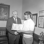 Dr. Ernest Stone Congratulates Jimmy Champion, 1970 Little All American 1 by Opal R. Lovett