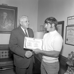 Dr. Ernest Stone Congratulates Jimmy Champion, 1970 Little All American 2 by Opal R. Lovett