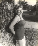 Female Individual Dressed in Bathing Suit Leaning Against Tree on Campus 1 by unknown