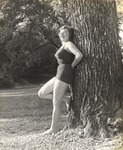 Female Individual Dressed in Bathing Suit Leaning Against Tree on Campus 2 by unknown