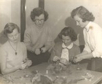 Four Female Students Make Flower Corsages by unknown
