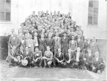 Group of 1930s Male Individuals Gathered Outside Building by unknown