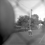 Male Playing Tennis on Tennis Court by Opal R. Lovett