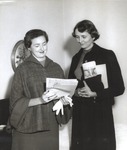 Alumni Martha Sandifer and Bonnie Ridgeway Looking at October 15, 1954 Issue of The Collegian by Opal R. Lovett