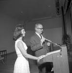President Houston Cole and Female Individual Stand at Podium Together by Opal R. Lovett