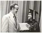Charles Rowe, Vice President for Business Affairs, with Female Individual Dressed in Graduation Cap and Gown by Opal R. Lovett