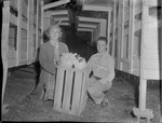 Mrs. Hannah M. Hilley with Nephew Jimmie Sutley Caring for Rabbits by Opal R. Lovett
