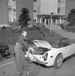 Student Loading Trunk of Car, 1975-1976 Campus Scenes 2 by Opal R. Lovett
