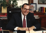 President Harold McGee Seated at Desk in Office 1 by unknown