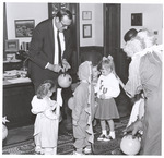 President Harold McGee Passes Out Candy to Children at Halloween, circa 1986-1999 by William Edward Hill