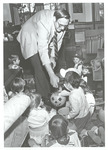 President Harold McGee Passes Out Candy to Visiting Children 1 by William Edward Hill