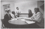 Students at Table by Whiteboard, circa 2003 by unknown