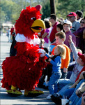 Cocky Greets Children at Parade, circa 2006 by unknown