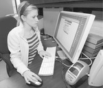 Student at Desk Using Computer, circa 2007 by unknown
