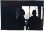 Two Individuals Standing in Rowe Hall Lounge, circa 1984 by unknown