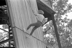 Individual Rappelling Down ROTC Rappel Tower 4, circa 1985 by unknown