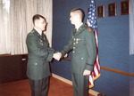 Lt. Col. Merriss Congratulates Cadet, circa 1997-2001 ROTC Ceremony Scene by unknown