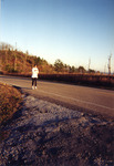 Individual Running on Paved Road, circa 2003 by unknown